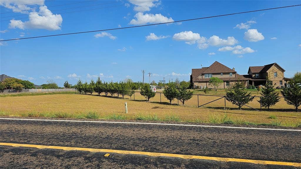 000 FM-1392, Terrell, TX 75160 View from the road showing neighborhood to the northeast side.