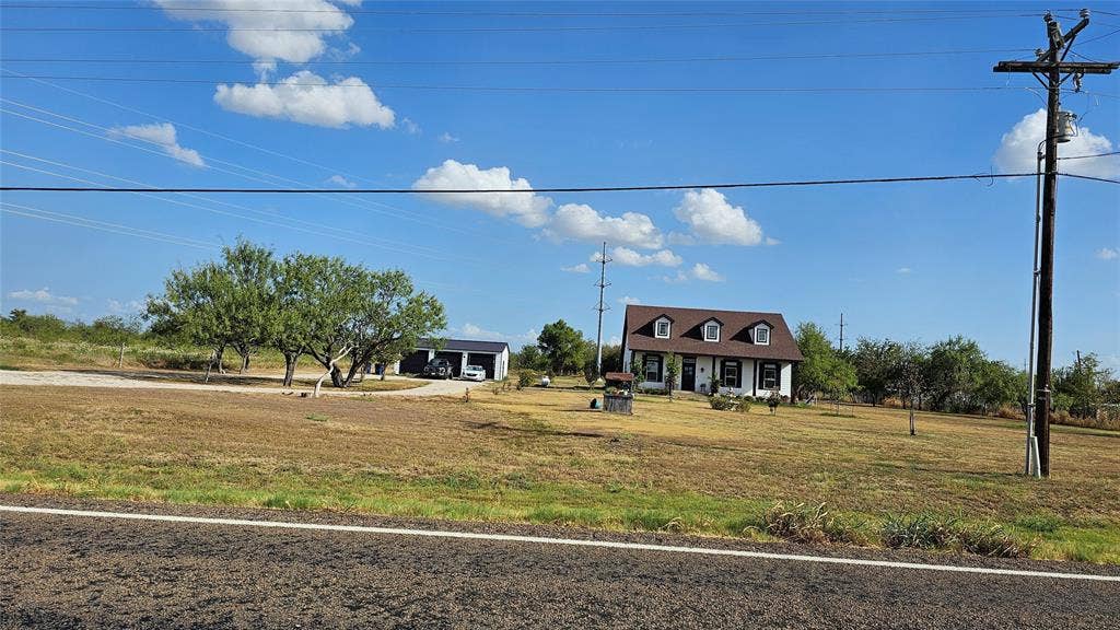 000 FM-1392, Terrell, TX 75160 View from the road of neighboring structure, south of the property.
