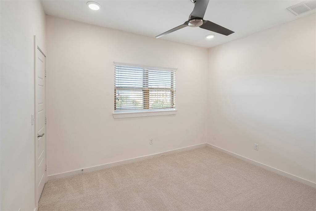 Recessed lighting, ceiling fan with light, window with blinds, and light-toned carpeting