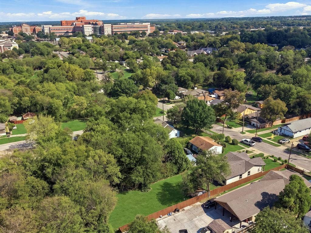 1727 Mentor Avenue, Dallas, TX 75216 Expansive green space surrounded by mature trees, featuring residential properties and community infrastructure