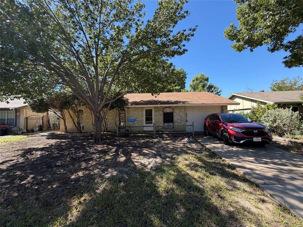 4031 Hartford Drive, Garland, TX 75043 Single-story residence featuring a brick exterior and an attached garage