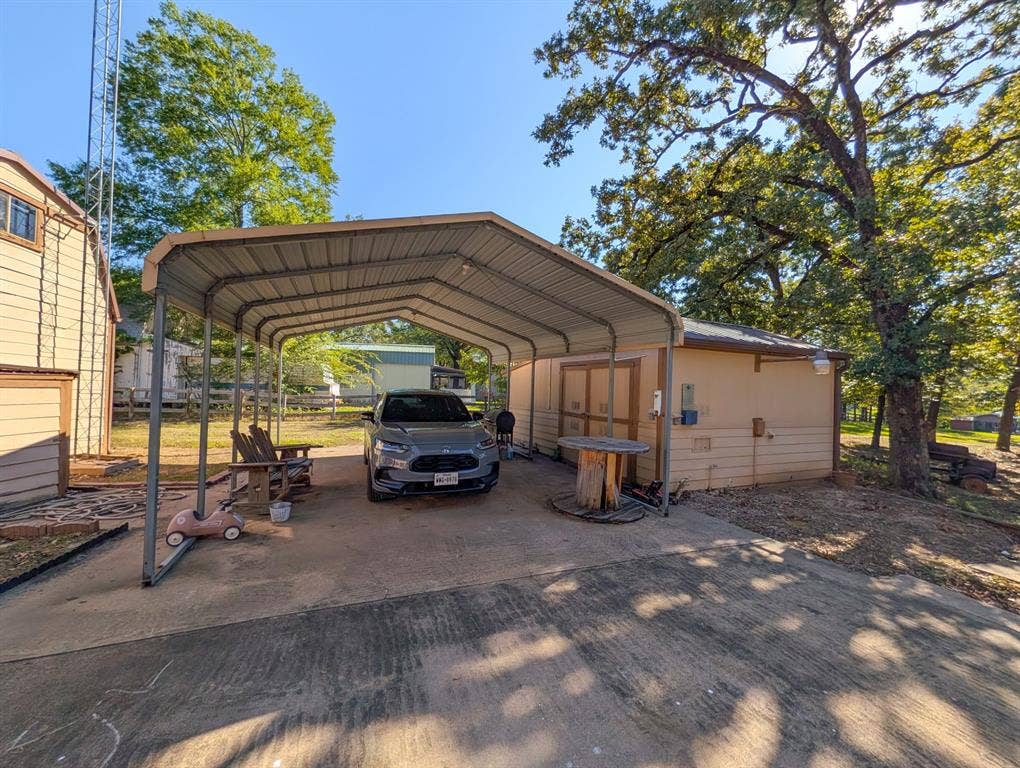 Carport with enough room for 4 cars Plus a storage building