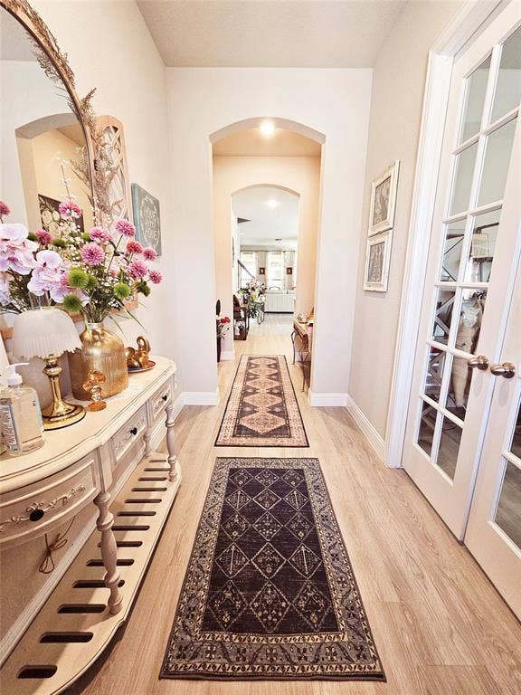 Wood-finish flooring throughout the hallway