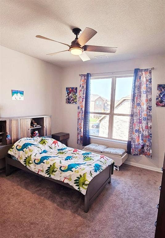 Recessed lighting, ceiling fan with integrated light, dual-pane window, and carpet flooring
