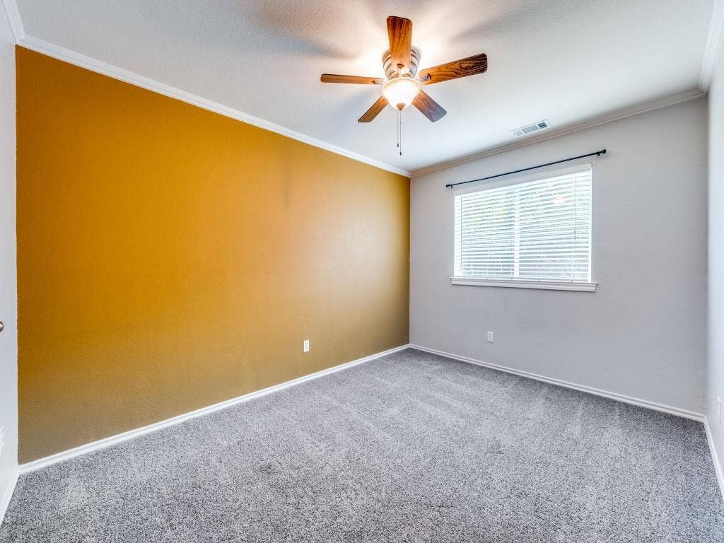 5604 Parkplace Drive, Denton, TX 76226 Carpeted room with a ceiling fan light fixture, crown molding, and window with blinds