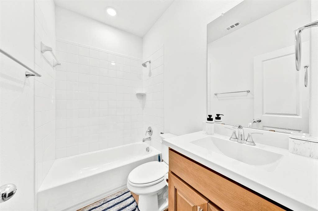 3928 Bison Lane, Crandall, TX 75114 White subway tile shower surround with a built-in shelf
