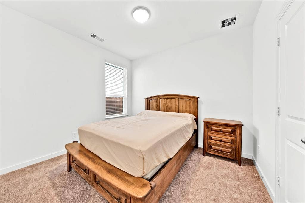 3928 Bison Lane, Crandall, TX 75114 Carpeted flooring, window with blinds, and recessed lighting