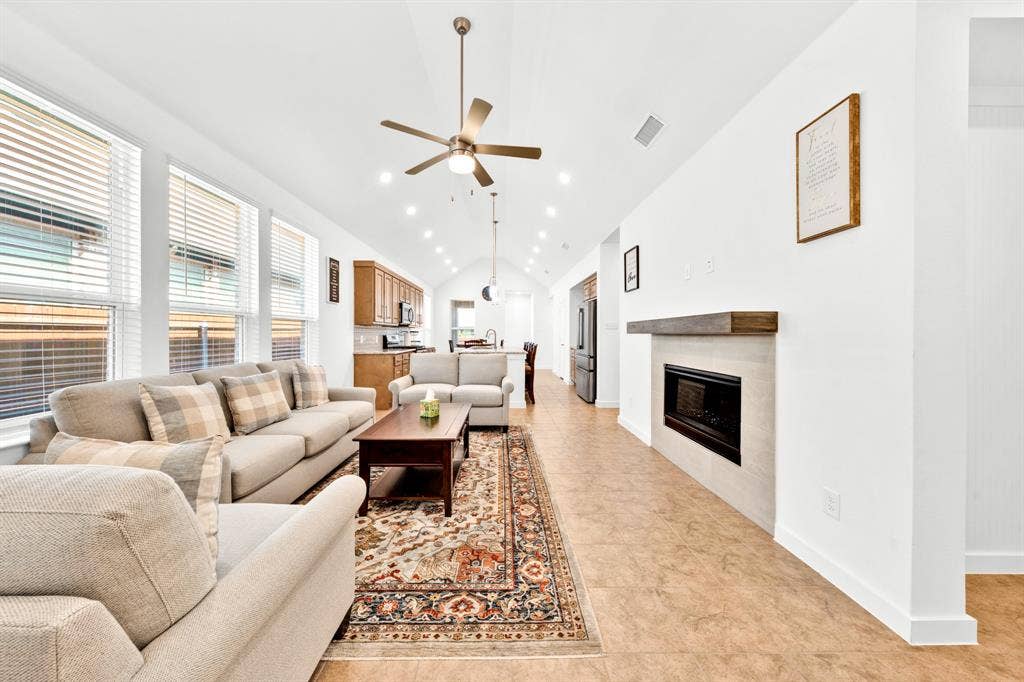 3928 Bison Lane, Crandall, TX 75114 Vaulted ceilings, recessed lighting, and a ceiling fan enhance the living area