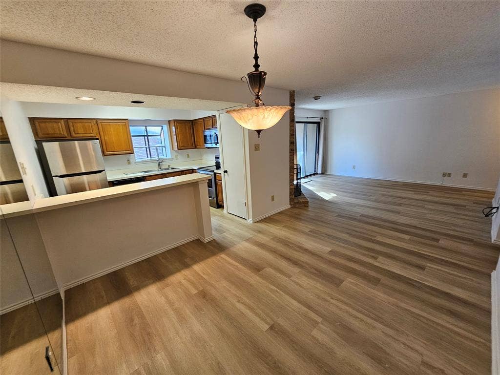 Dining area with bar eading to kitchen