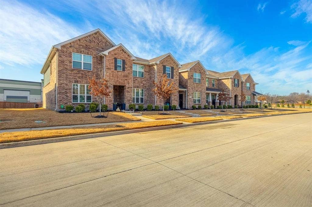 2812 Appaloosa Lane, Mesquite, TX 75150 Brick exterior with dark shutters, gabled rooflines, and a covered entry