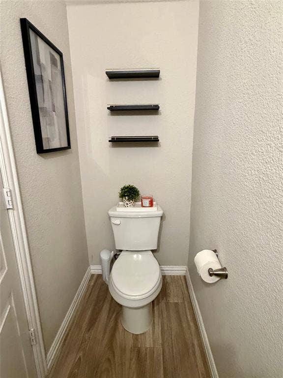 2812 Appaloosa Lane, Mesquite, TX 75150 Wood-finish flooring, white baseboards, and wall-mounted shelving