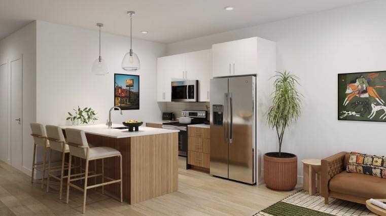 9801 Plainfield Drive, #WW9807, Fort Worth, TX 76108 Kitchen featuring appliances with stainless steel finishes, a kitchen breakfast bar, hanging light fixtures, white cabinetry, and decorative backsplash