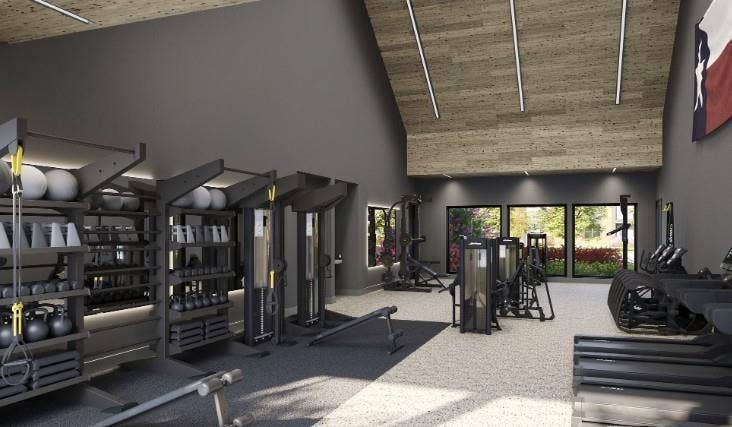Workout area with high vaulted ceiling