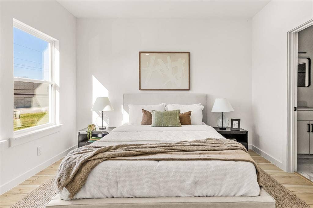 2232 Hooper Street, Dallas, TX 75215 Light wood-finish flooring, a double-hung window, and a white wall finish