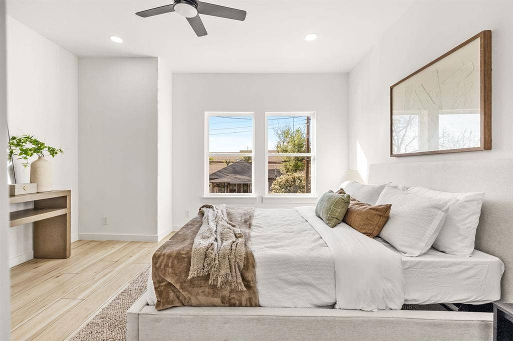 2232 Hooper Street, Dallas, TX 75215 Light wood-finish flooring, recessed lighting, ceiling fan, and two windows