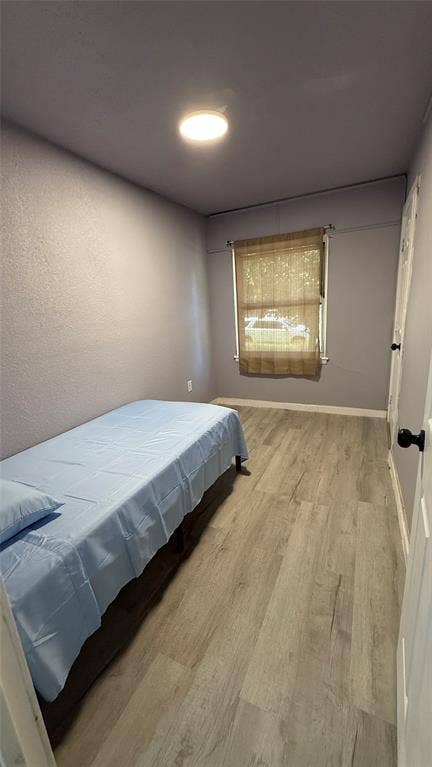 605 Biggs Terrace, Arlington, TX 76010 Recessed ceiling light, wood-finish flooring, single window with blinds, white paneled door