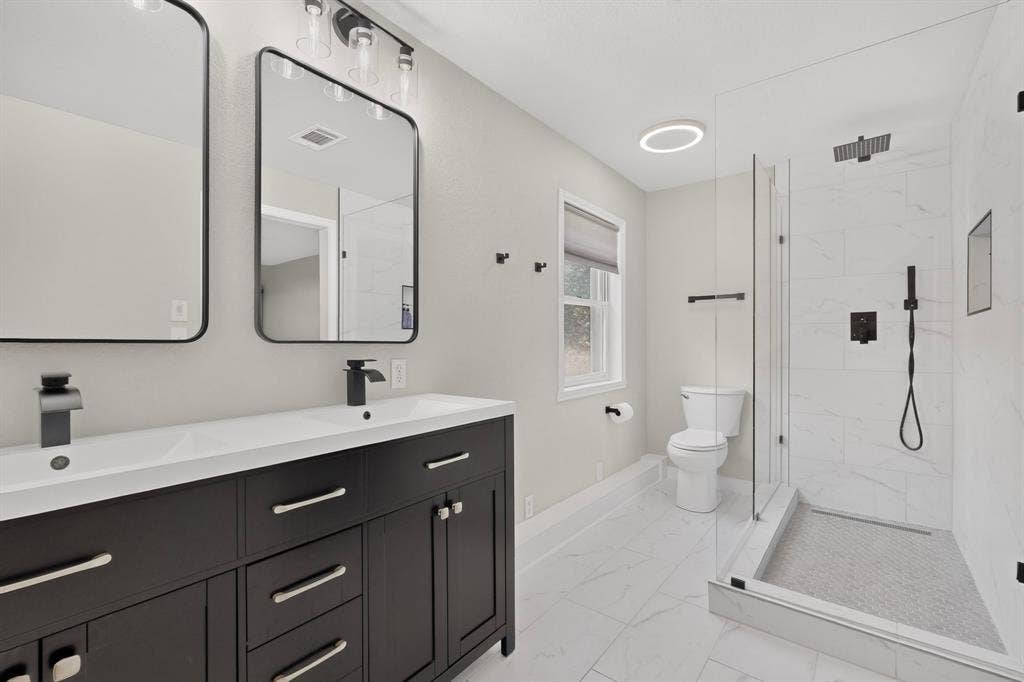 Primary Bathroom with Dual Vanities and Walk in Shower