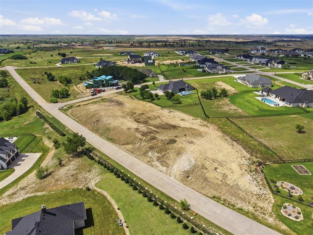 12300 Bella Quinn Drive, Fort Worth, TX 76126 Expansive lot featuring graded terrain, paved road frontage, and surrounding residential properties