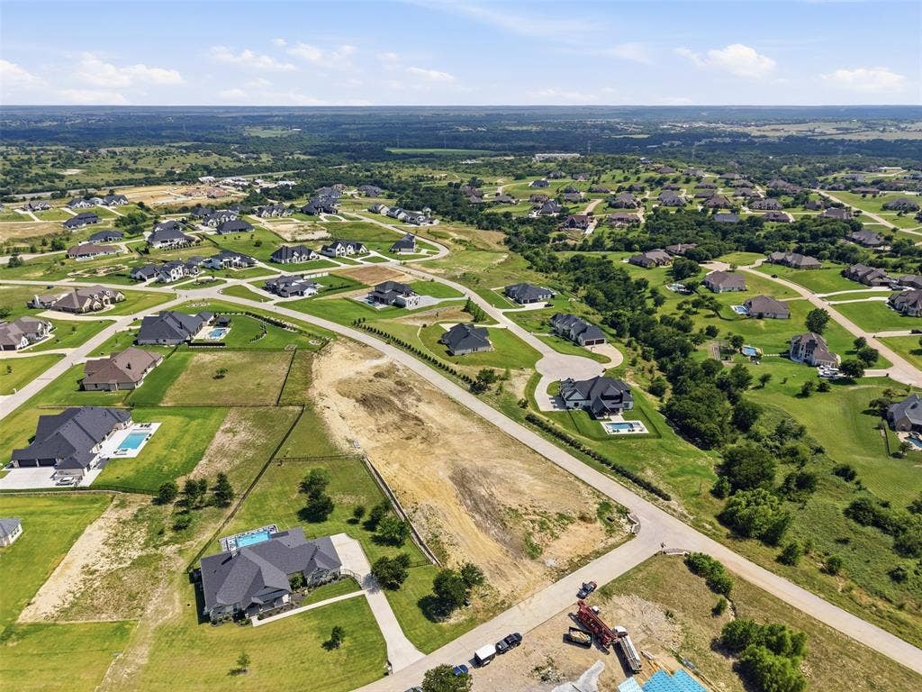 12300 Bella Quinn Drive, Fort Worth, TX 76126 Expansive land parcel within a residential development, surrounded by custom residences