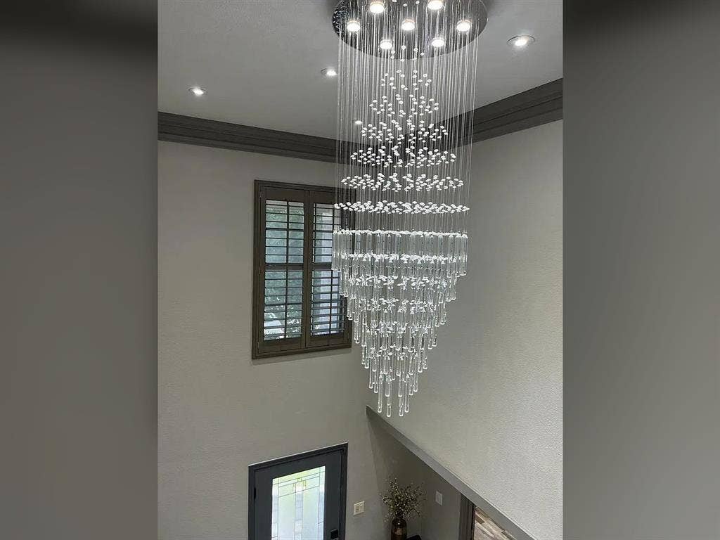 2500 Sierra Drive, McKinney, TX 75071 Multi-tiered chandelier with crystal accents, recessed ceiling lighting, and a window with plantation shutters