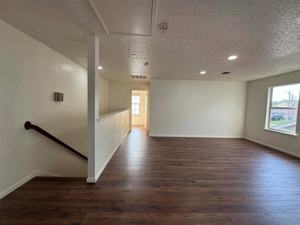 7305 Marsland Lane, Arlington, TX 76001 Open-concept room featuring wood-finish flooring, recessed lighting, and white baseboards