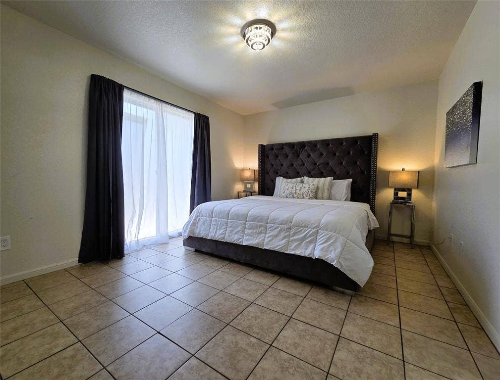 Another view of the primary bedroom