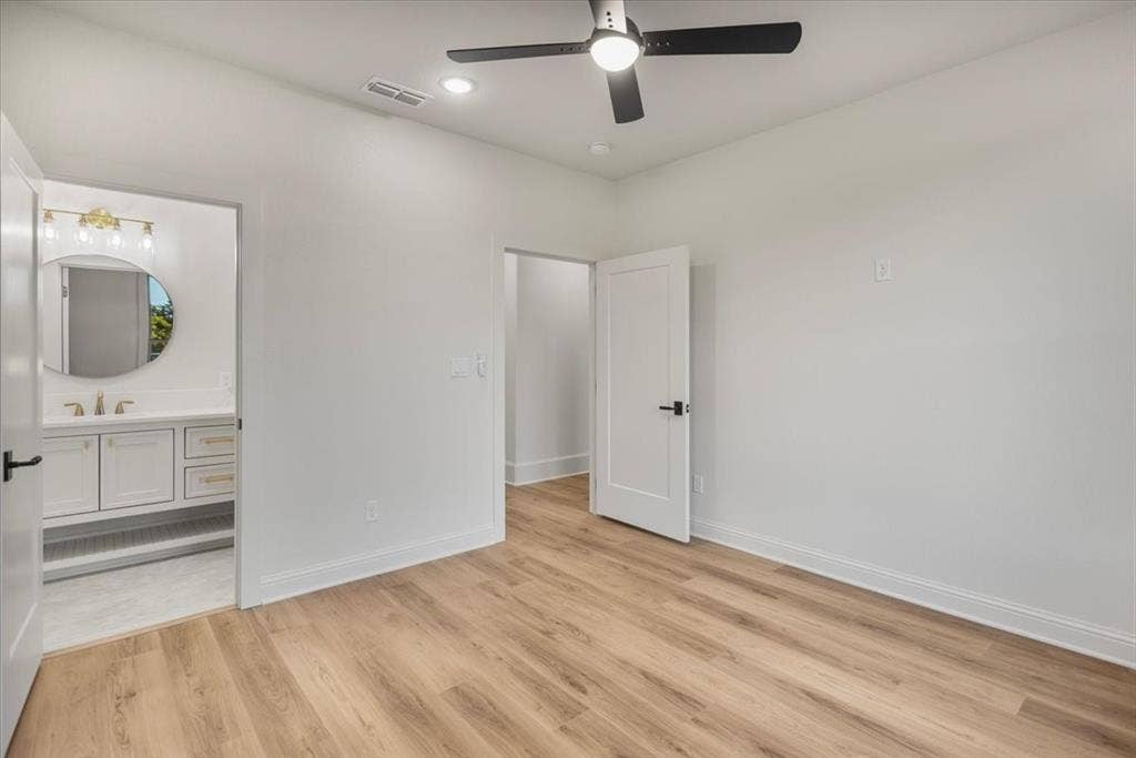 Wood-finish flooring, recessed lighting, and a ceiling fan