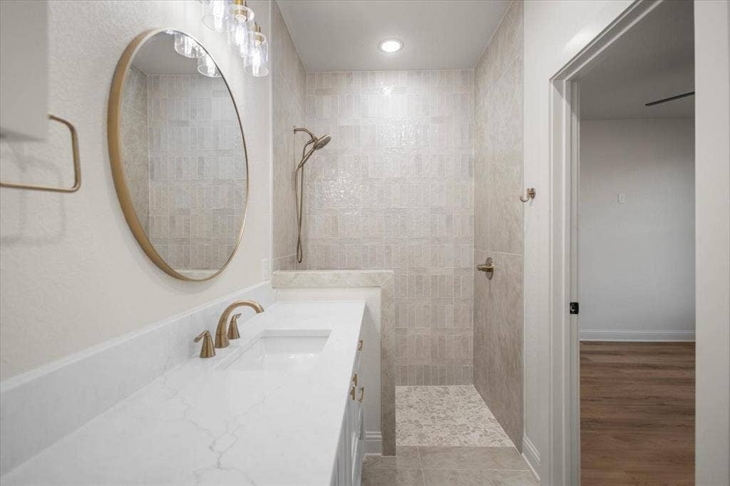 Quartz countertop with integrated sink and brass-finish faucet