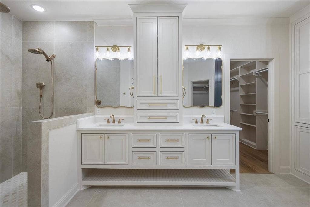 Dual vanity with white cabinetry and integrated sinks