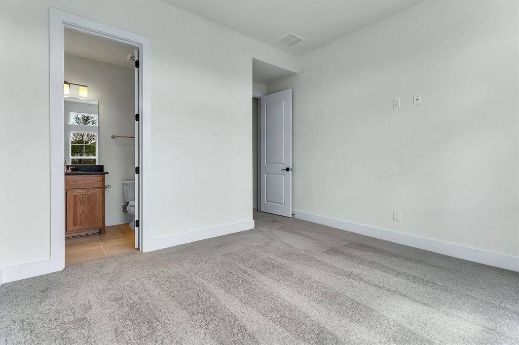 115 Cottonwood Court, Murphy, TX 75094 Light-colored wall-to-wall carpeting, white walls, and a white trim package