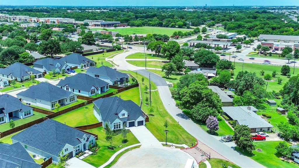115 Cottonwood Court, Murphy, TX 75094 Residential development featuring modern single-family homes with dark roofs and light-colored exteriors