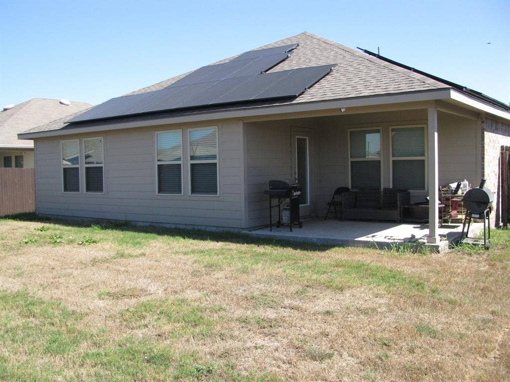 1322 Bushel Drive, Royse City, TX 75189 Large covered patio perfect for relaxing or just sitting in the shade while grilling. The electric bills are very reasonable due to the solar panels.
