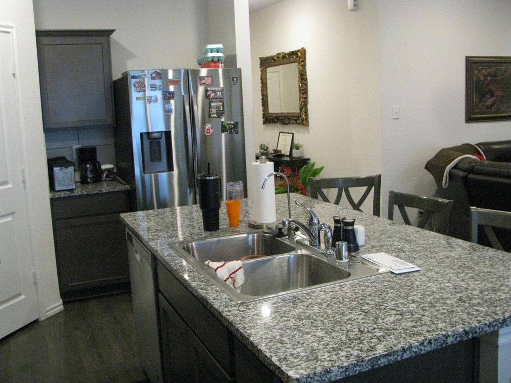 1322 Bushel Drive, Royse City, TX 75189 Another view of the kitchen shows the nook next to the fridge...perfect for a coffee bar area.