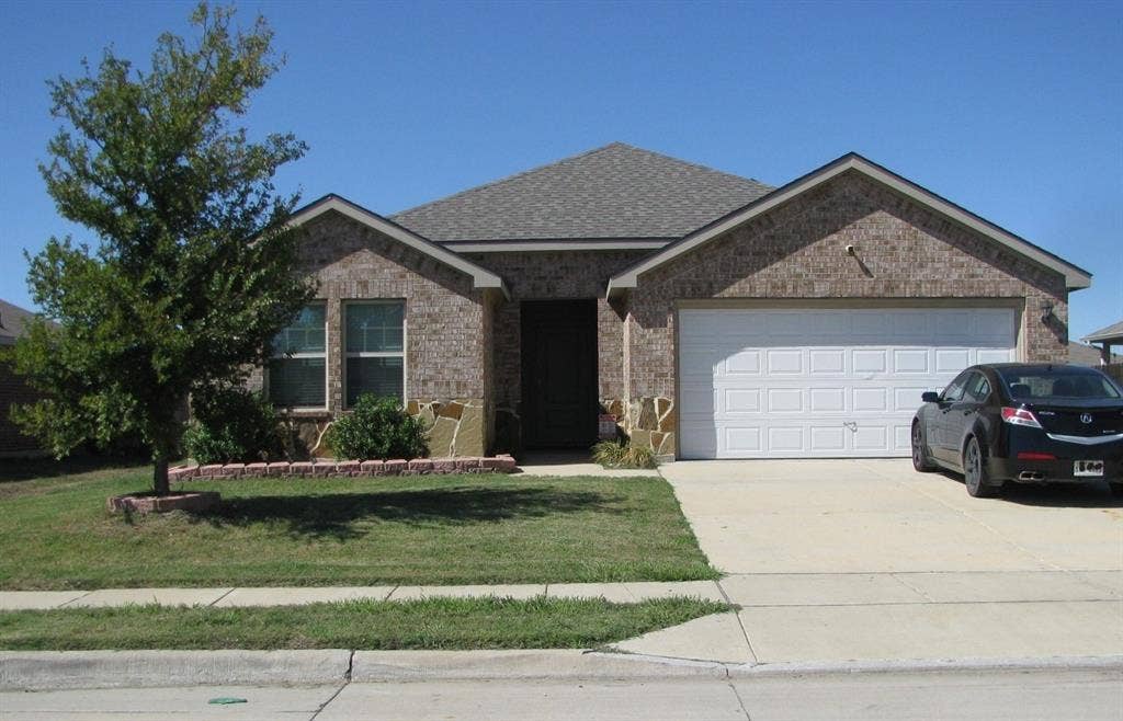 1322 Bushel Drive, Royse City, TX 75189 Beautiful drive up appeal...brick and stone elevation and nice landscaping.