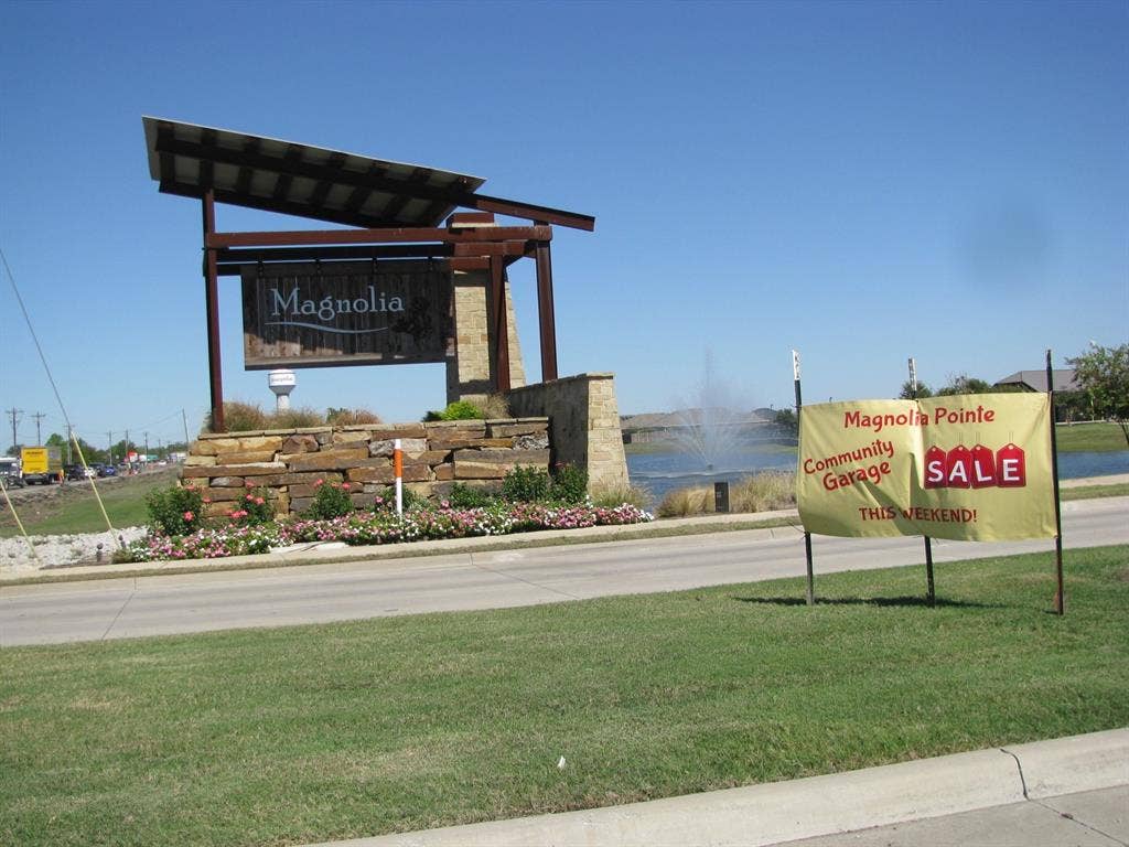 1322 Bushel Drive, Royse City, TX 75189 Community entry signage and a view of the community pond with fountains.