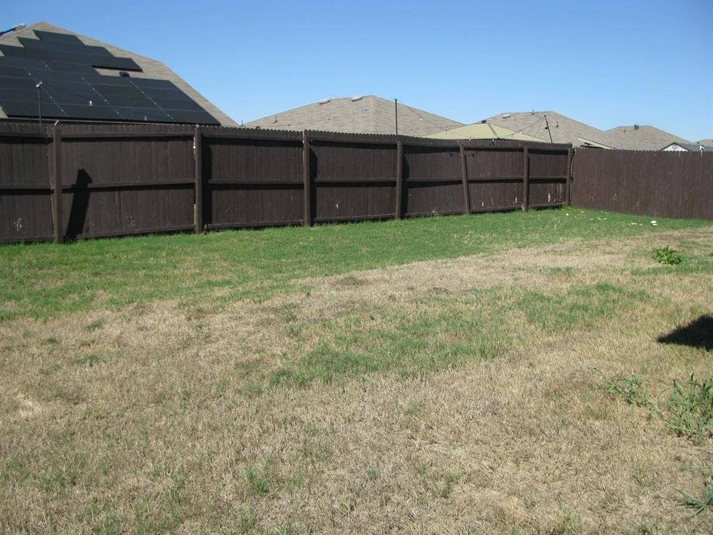 1322 Bushel Drive, Royse City, TX 75189 Large fenced back yard.