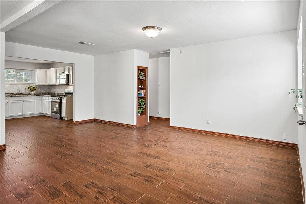 2527 Talco Drive, Dallas, TX 75241 Tile with Wood look flows through Living to Kitchen
