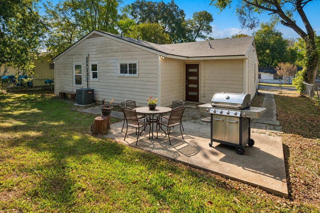 2527 Talco Drive, Dallas, TX 75241 Rear View of Home and Patio - Virtually staged