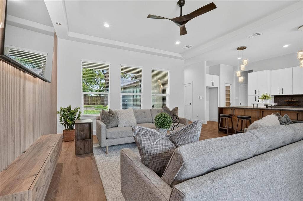 3210 Carpenter Avenue, Dallas, TX 75215 Hardwood-style flooring throughout, recessed lighting, and a modern ceiling fan
