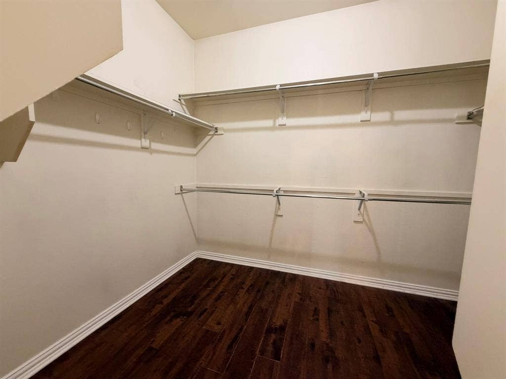 5016 Rushden Road, McKinney, TX 75070 Integrated shelving, multiple hanging rods, and wood-finish flooring