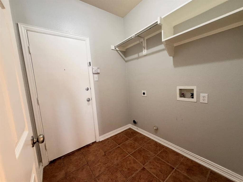 5016 Rushden Road, McKinney, TX 75070 Utility area featuring tile flooring, white walls, and built-in shelving