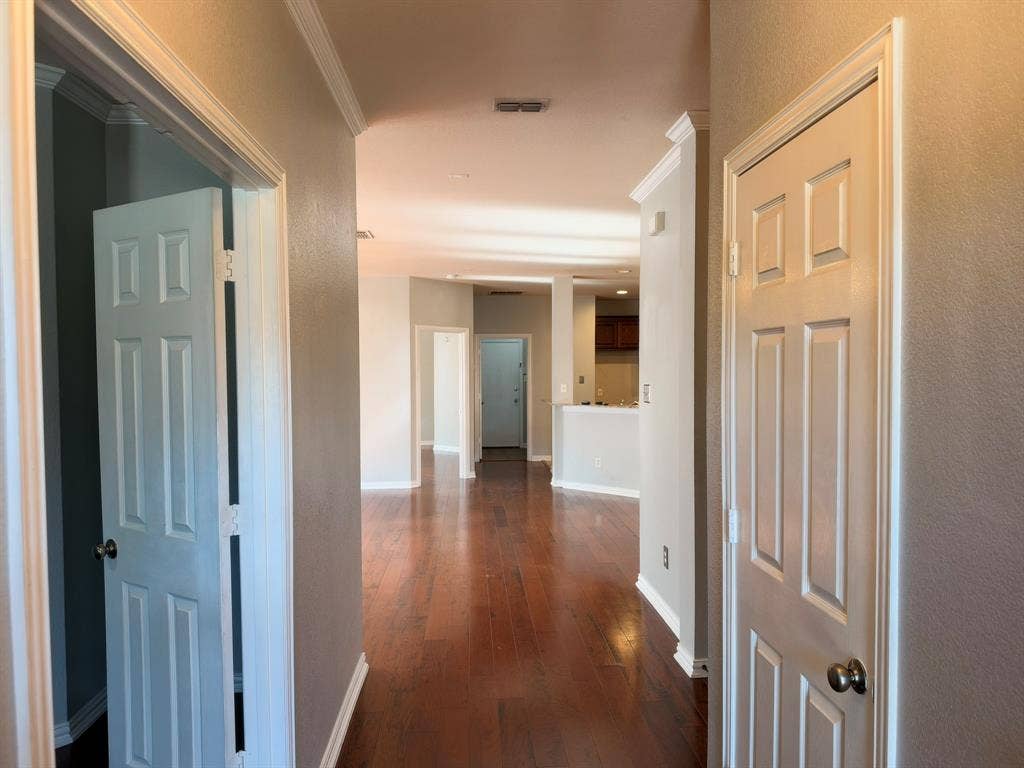 5016 Rushden Road, McKinney, TX 75070 Wood-finish flooring throughout, crown molding, and paneled interior doors