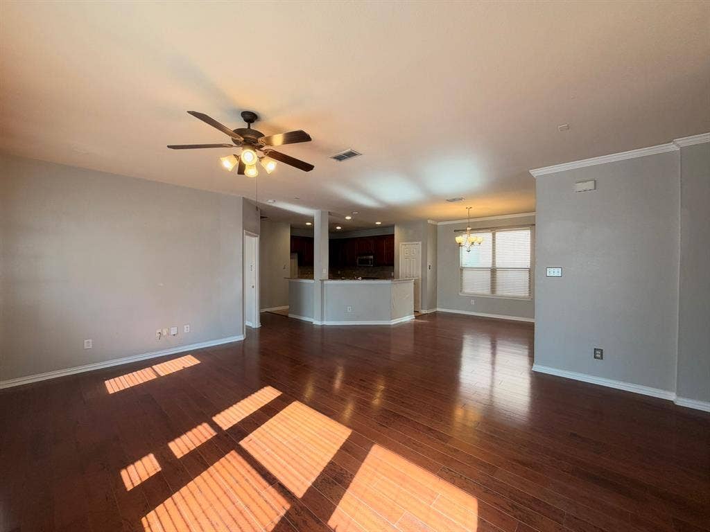 5016 Rushden Road, McKinney, TX 75070 Wood-finish flooring throughout, ceiling fan with integrated lighting, recessed lighting, and crown molding