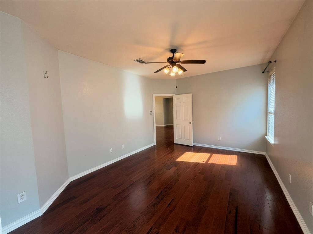 5016 Rushden Road, McKinney, TX 75070 Wood-finish flooring, ceiling fan with integrated lighting, neutral wall paint, and white trim