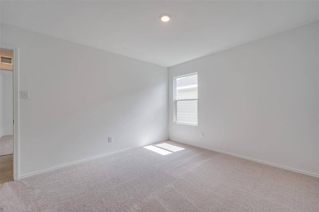3700 Bluebird Lane, McKinney, TX 75071 Spare room featuring carpet flooring