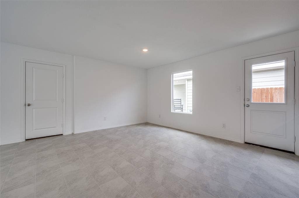 3700 Bluebird Lane, McKinney, TX 75071 Tiled empty room with a healthy amount of sunlight