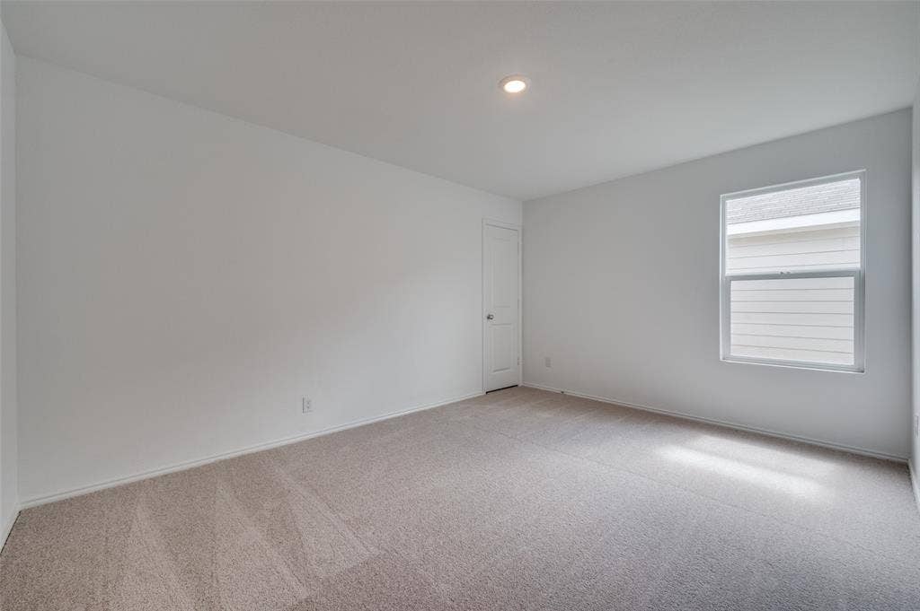 3700 Bluebird Lane, McKinney, TX 75071 Unfurnished room with carpet flooring and plenty of natural light