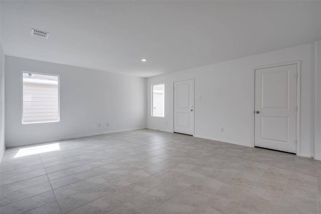 3700 Bluebird Lane, McKinney, TX 75071 Spare room with light tile floors