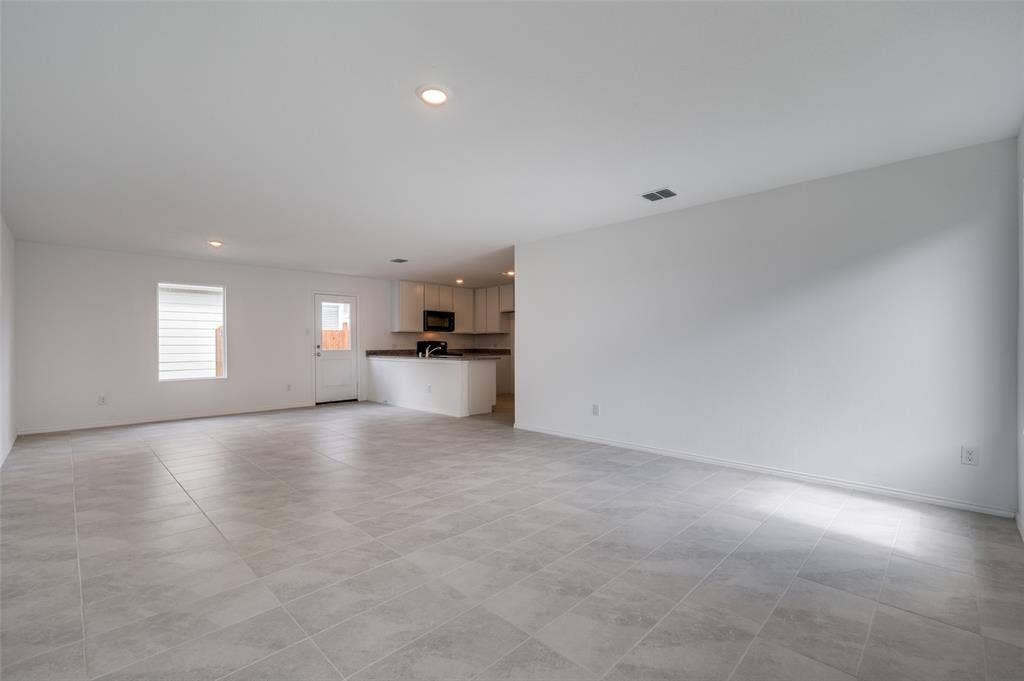 3700 Bluebird Lane, McKinney, TX 75071 Unfurnished living room with light tile floors