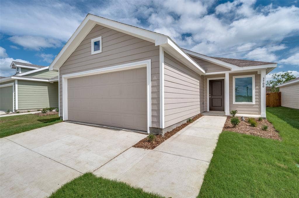 3700 Bluebird Lane, McKinney, TX 75071 Ranch-style house featuring a front yard and a garage